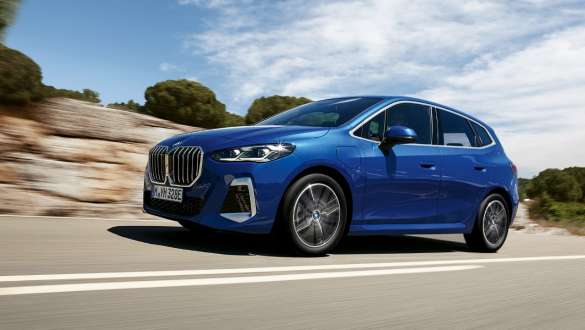 BMW 2 Series Active Tourer 230e plug-in hybrid U06 2021 M Portimao Blue metallic three-quarter side view driving on country road