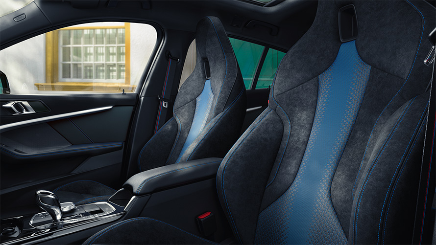 Ergonomically shaped M Sport seats in the BMW 1 Series F40 with contrast stitching and integrated headrest.