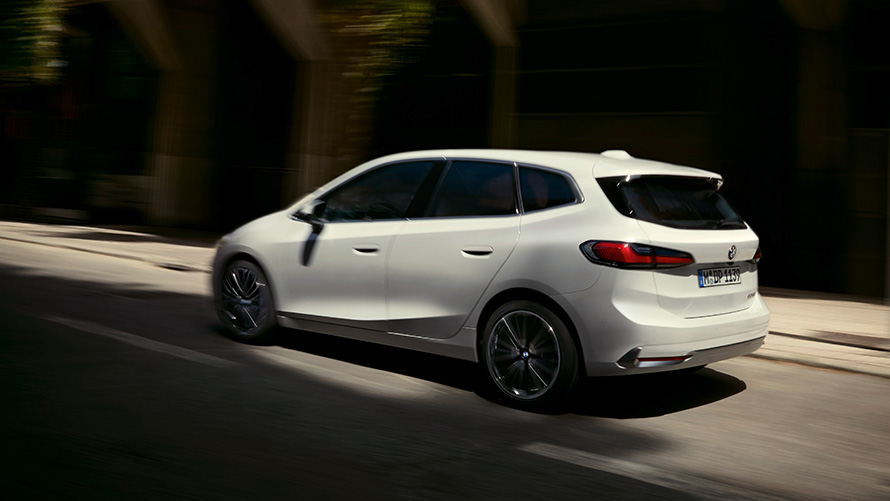 BMW 2 Series Active Tourer U06 2021 Mineral White metallic driving on the street side view