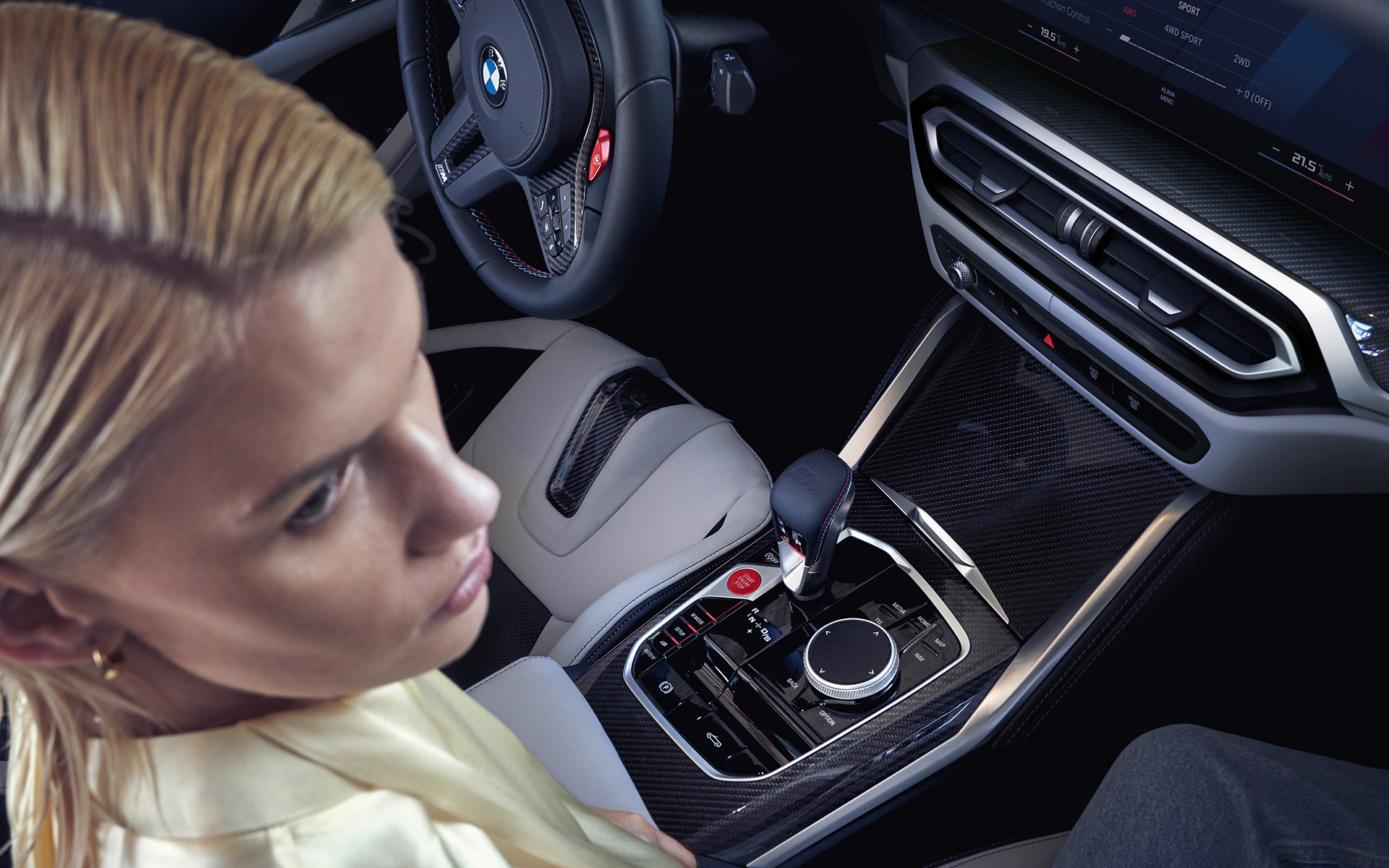 BMW M4 Competition Convertible with M xDrive G83 2021 centre console and women on passenger seat