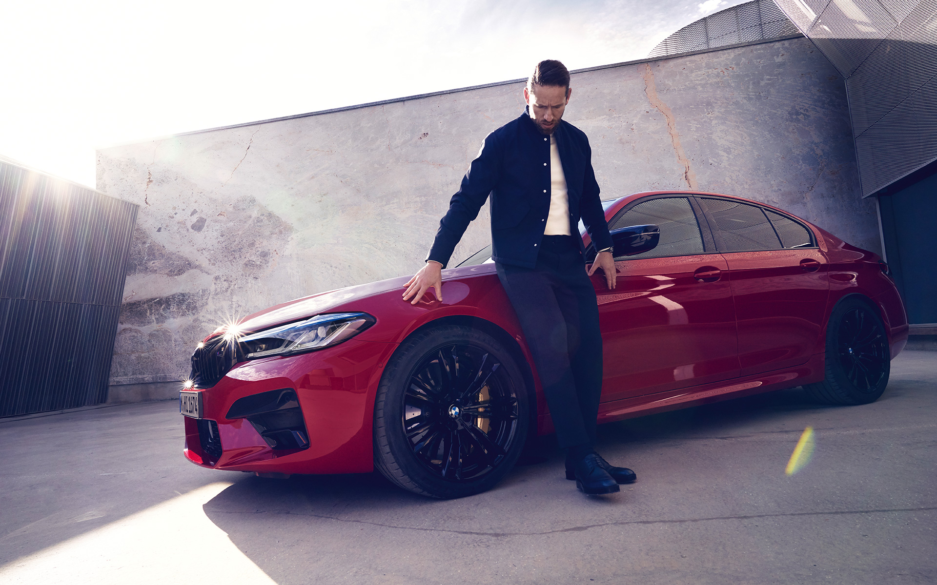 BMW M5 Competition F90 LCI Facelift 2020 BMW Individual Imola Red three-quarter front view with man