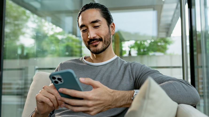 Man operating his smartphone 