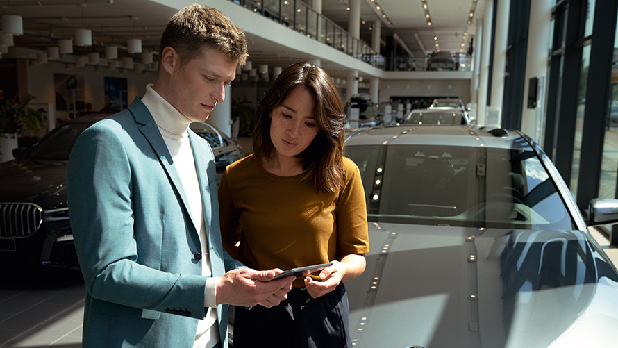 BMW Service Inclusive man and woman at the BMW dealer